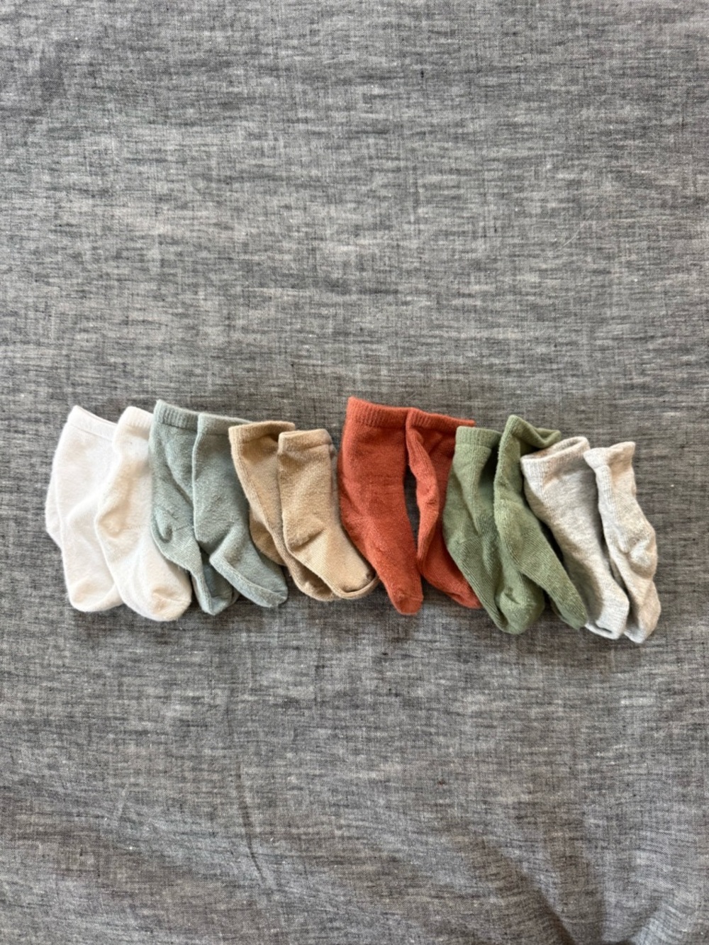 Like new 6-12m Gerber baby socks, solid neutral colors